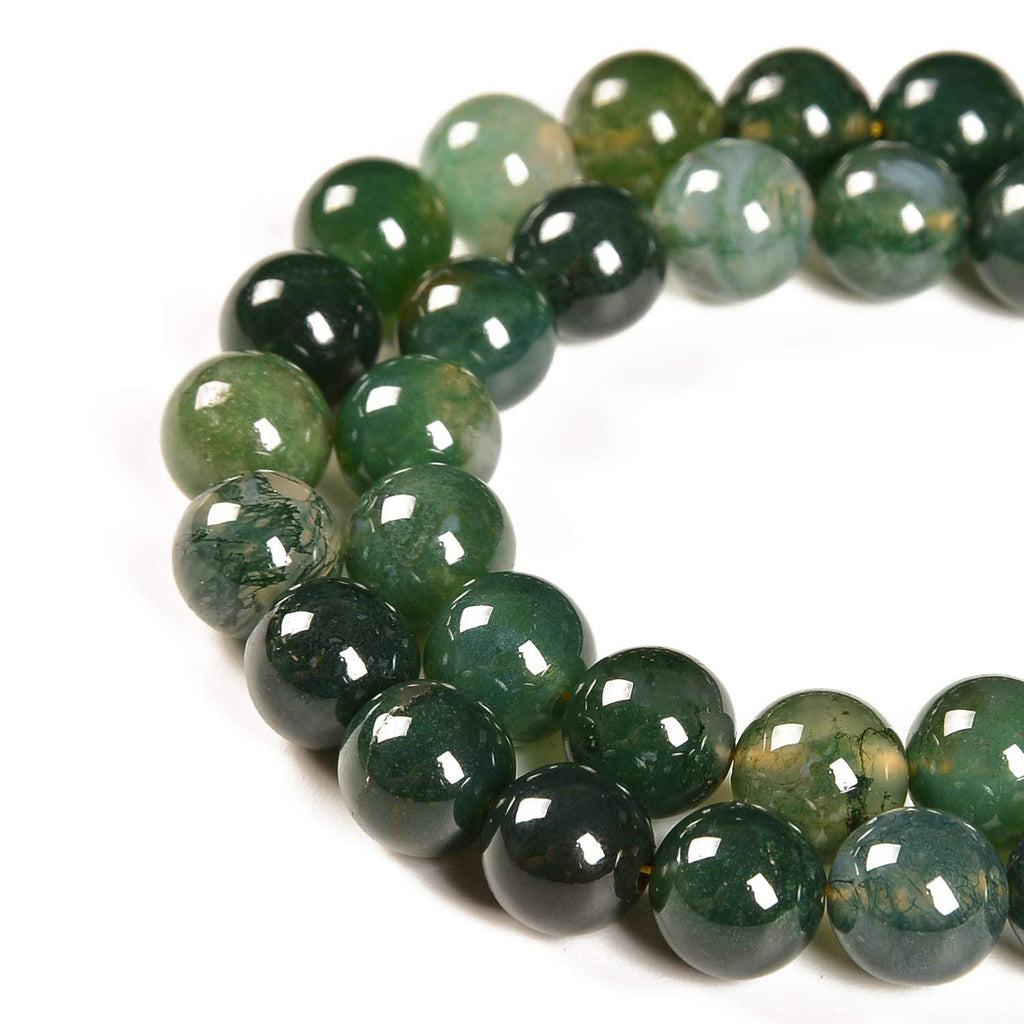 Strand of 4mm round moss agate gemstone spacer beads for jewelry making, close-up view on white background.