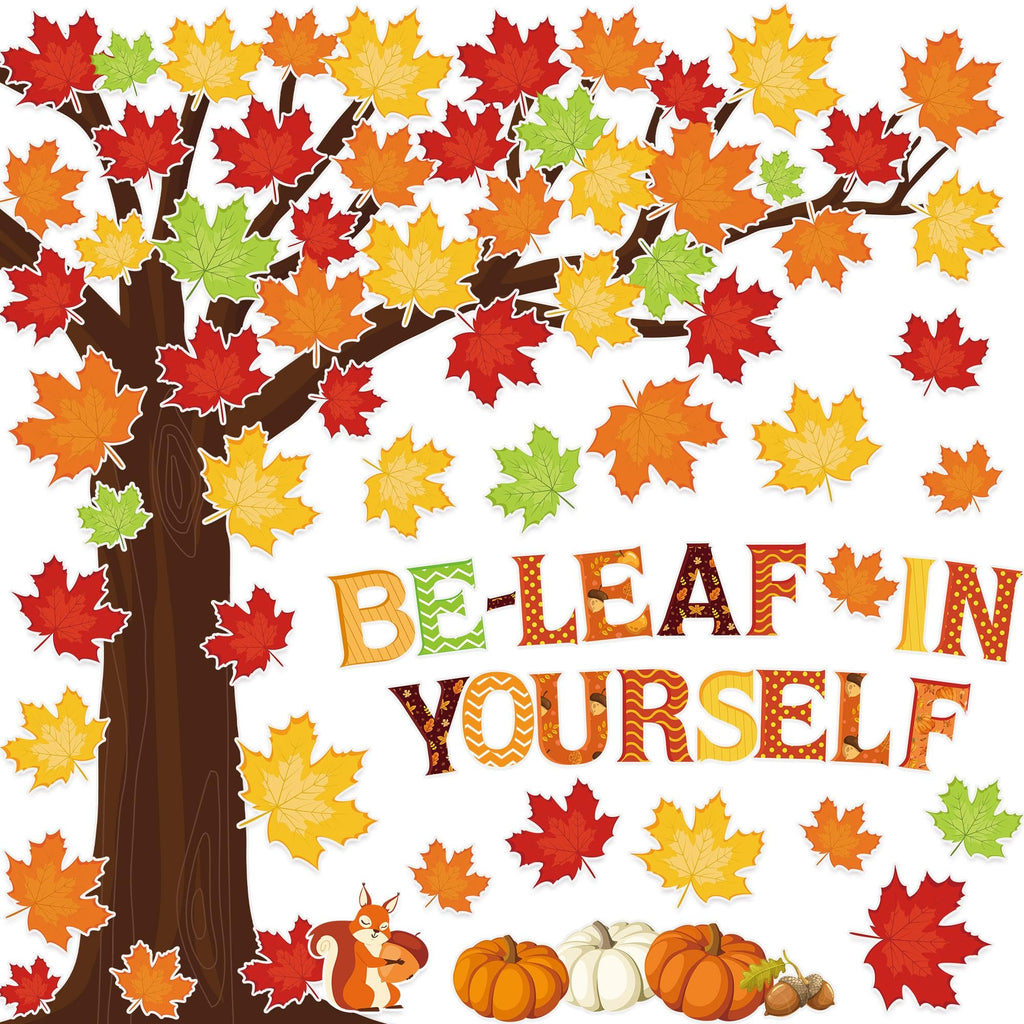 Fall-themed bulletin board set with a tree, maple leaves, pumpkins, acorns, a squirrel, and the words 'BE-LEAF IN YOURSELF'.