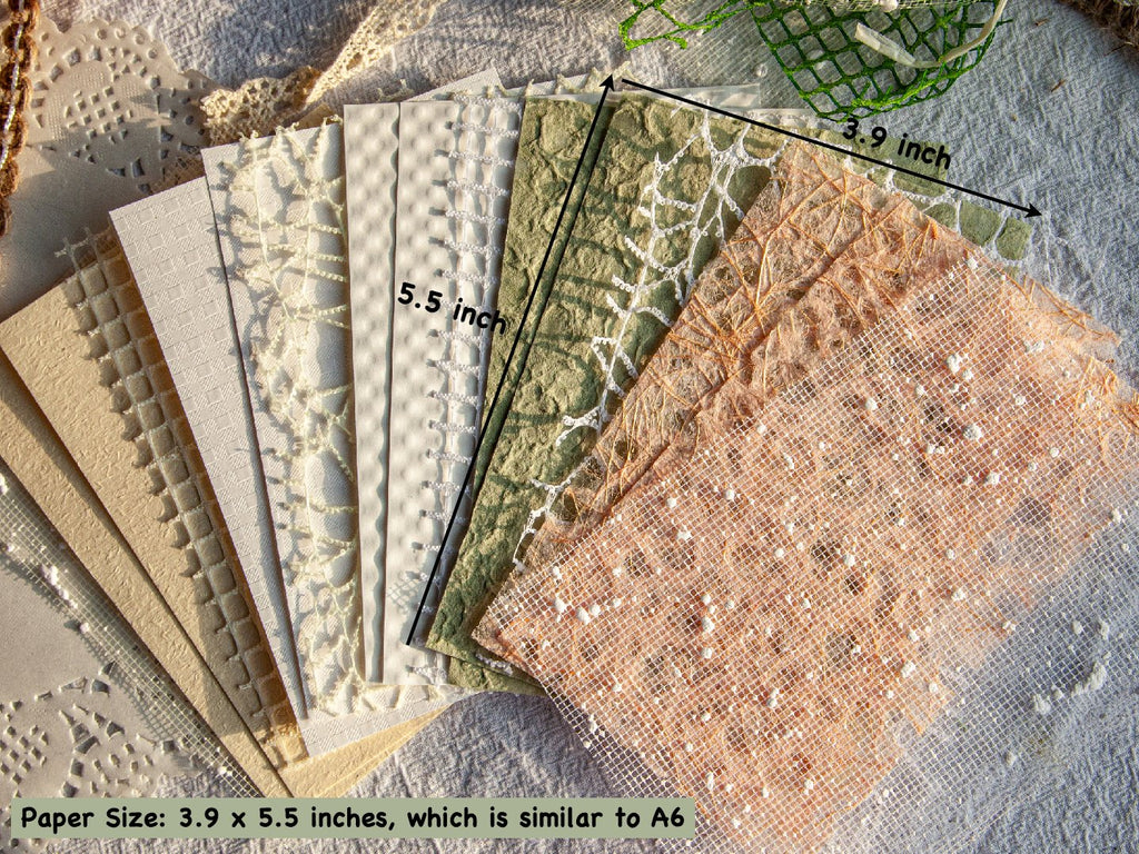 Assortment of textured scrapbook papers and mesh fabrics fanned out, showing various patterns and colors, with dimensions indicated.