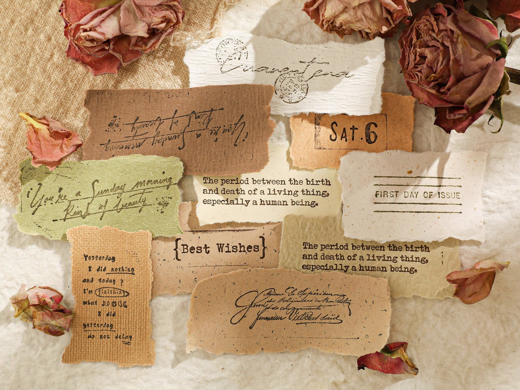 Collage of textured scrapbook paper pieces with vintage text and dried flowers, arranged on a textured background.