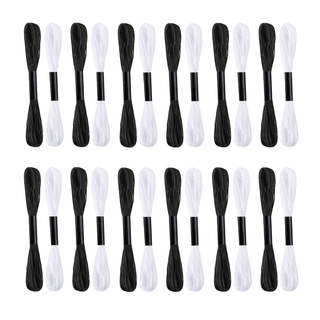 Two rows of black and white embroidery floss skeins on bobbins against a white background.