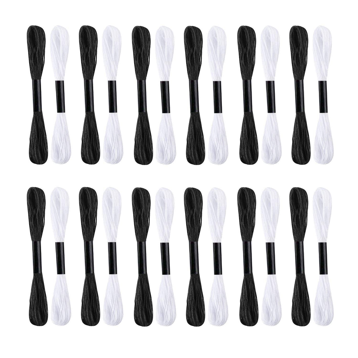 Two rows of black and white embroidery floss skeins on bobbins against a white background.