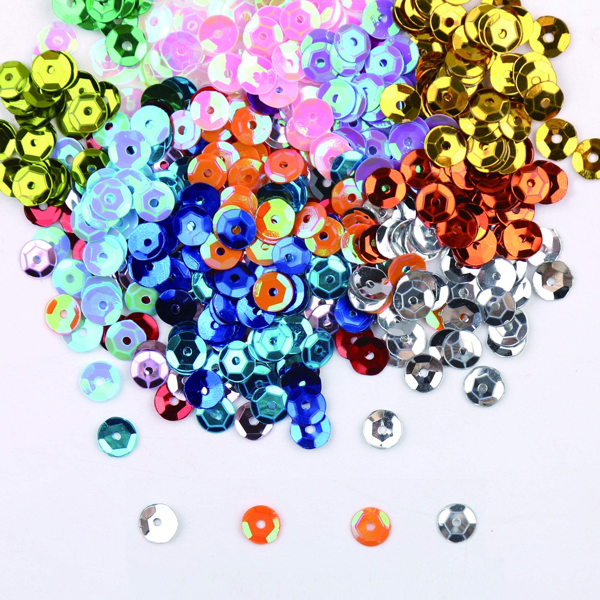 Pile of 6mm round cup sequins in 22 assorted colors, scattered on a white background.
