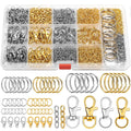 Keychain making kit with assorted silver and gold clasps, jump rings, and key rings in a clear organizer box and laid out below.