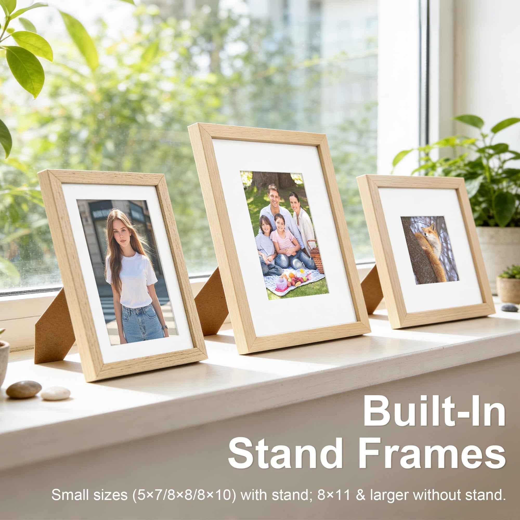 Three natural oak wood picture frames with white mats displayed on a windowsill, one showing a woman, another a family picnic, and the third a fox.