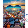 Paint by numbers kit with numbered paint pots and brushes on a beach pebble background with a crystal heart
