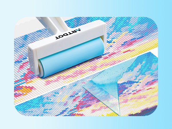 Diamond painting roller tool on a partially completed diamond art canvas, showing a blue roller and white handle.