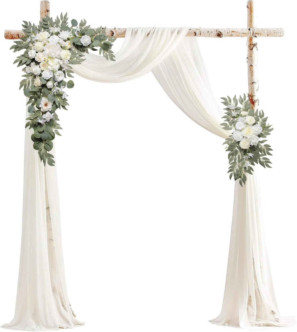 Wedding arch flowers and drapes kit with two corner floral arrangements and flowing white fabric against a white background.