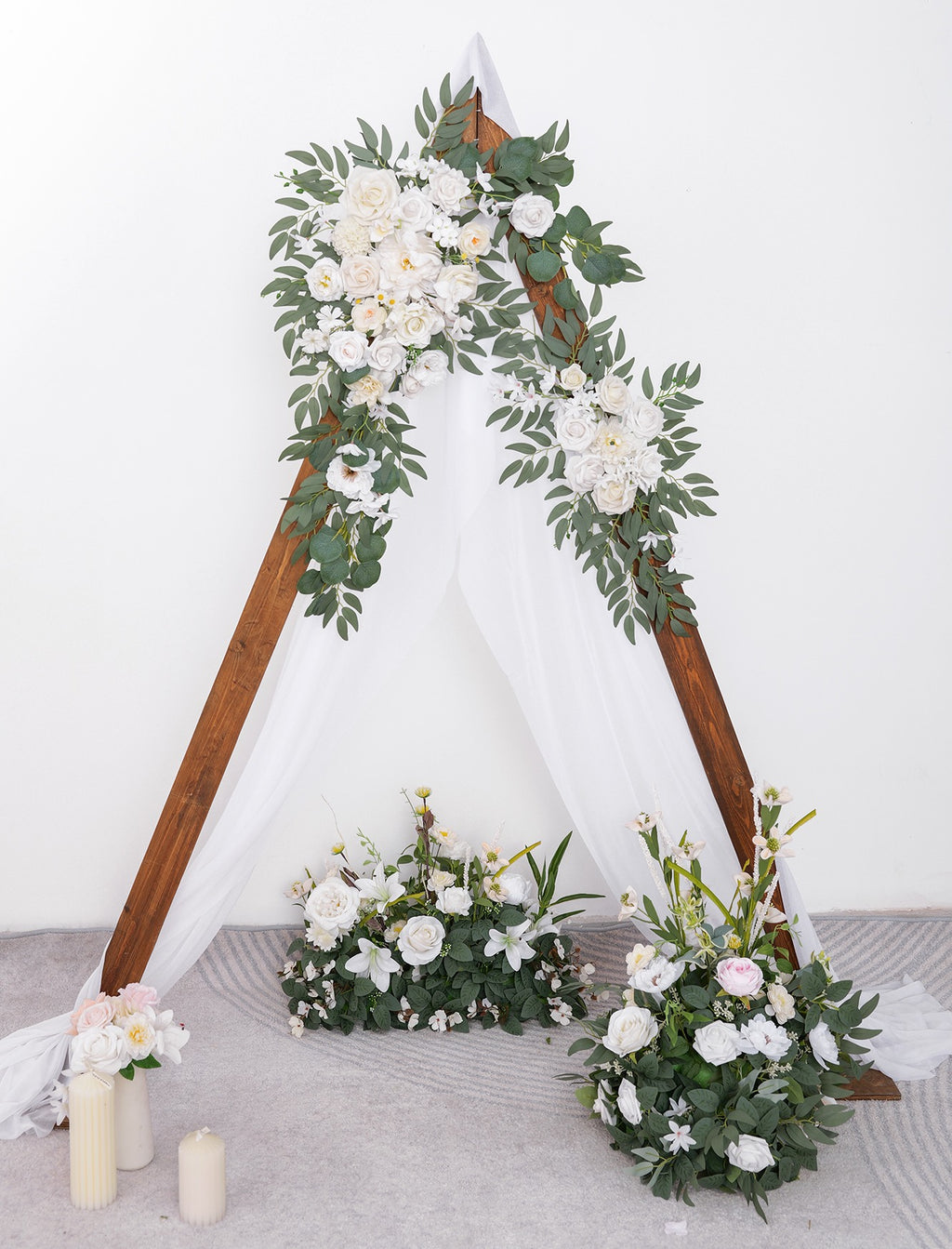 Wedding arch flowers and drapes kit with two corner garlands and gauze curtain, set on a wooden frame with floor arrangements.