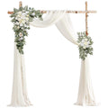 Wedding arch with floral garlands and draped fabric, shown against a white background.