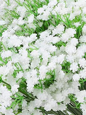 Close-up of white artificial baby's breath flowers with green stems, a dense floral arrangement.