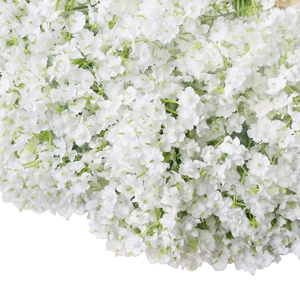 Close-up of a bouquet of white artificial baby's breath flowers with green stems, filling most of the frame.