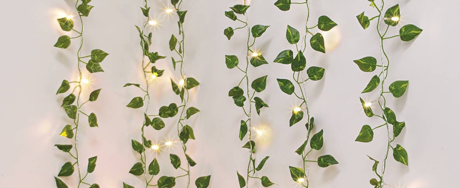 Artificial ivy vines with integrated LED fairy lights hanging against a white background.