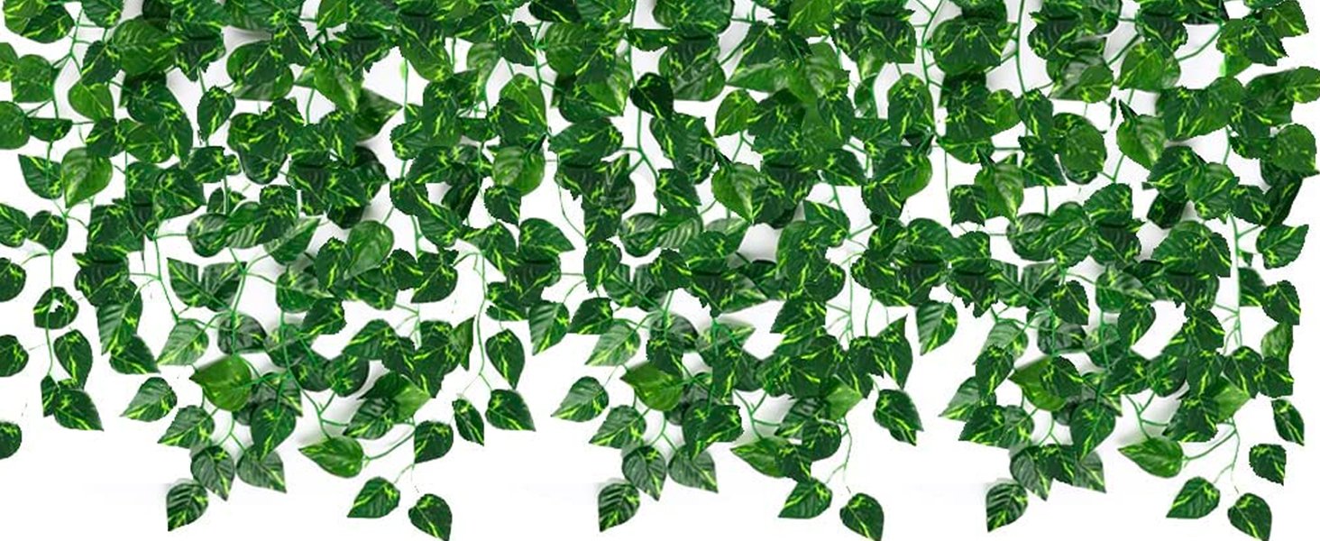 Artificial ivy vines with green silk leaves and plastic stems against a white background.
