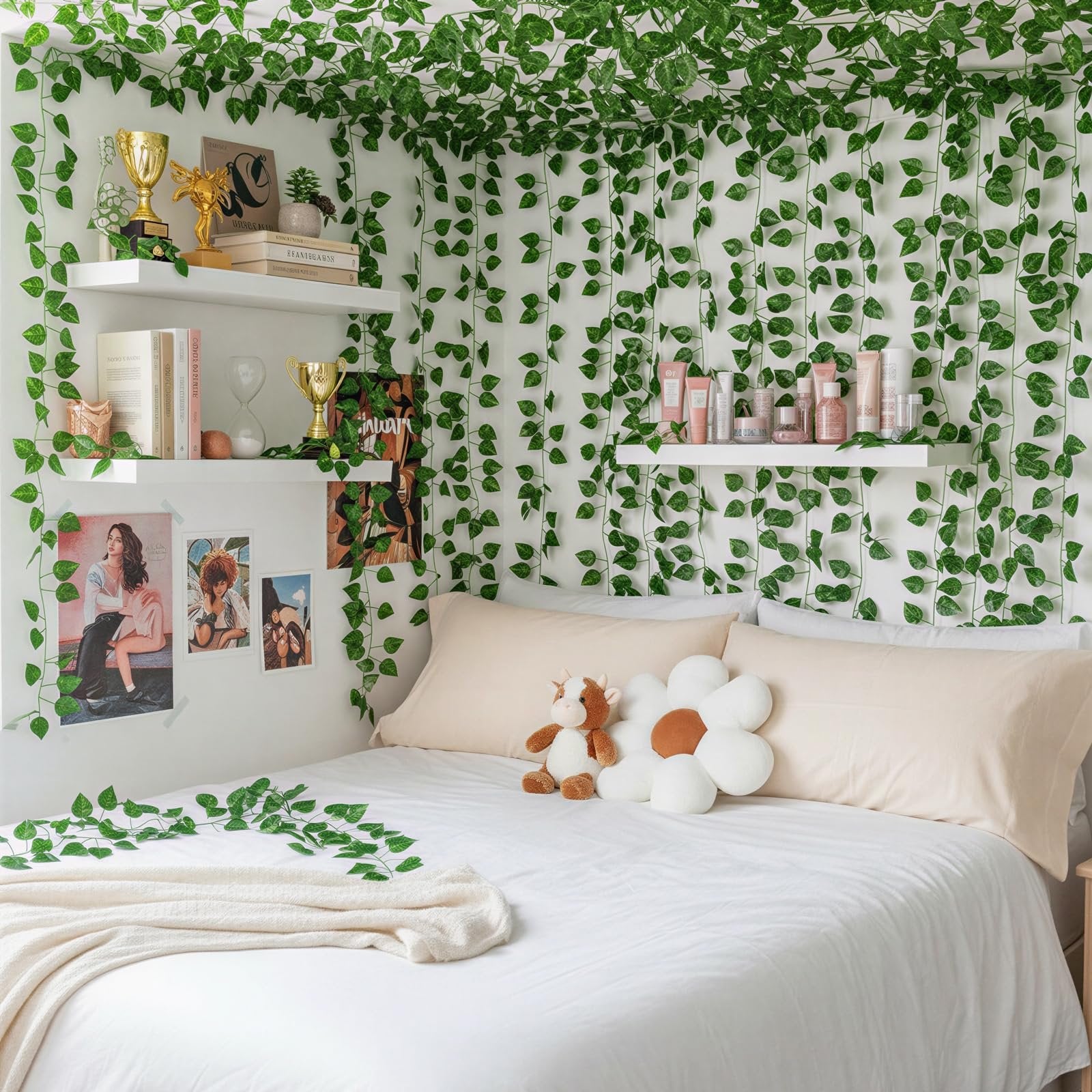 Bedroom decorated with artificial ivy vines, featuring a bed with pillows and a blanket.
