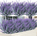 Artificial lavender bundles in gray-purple, shown in a white planter and against a white background.