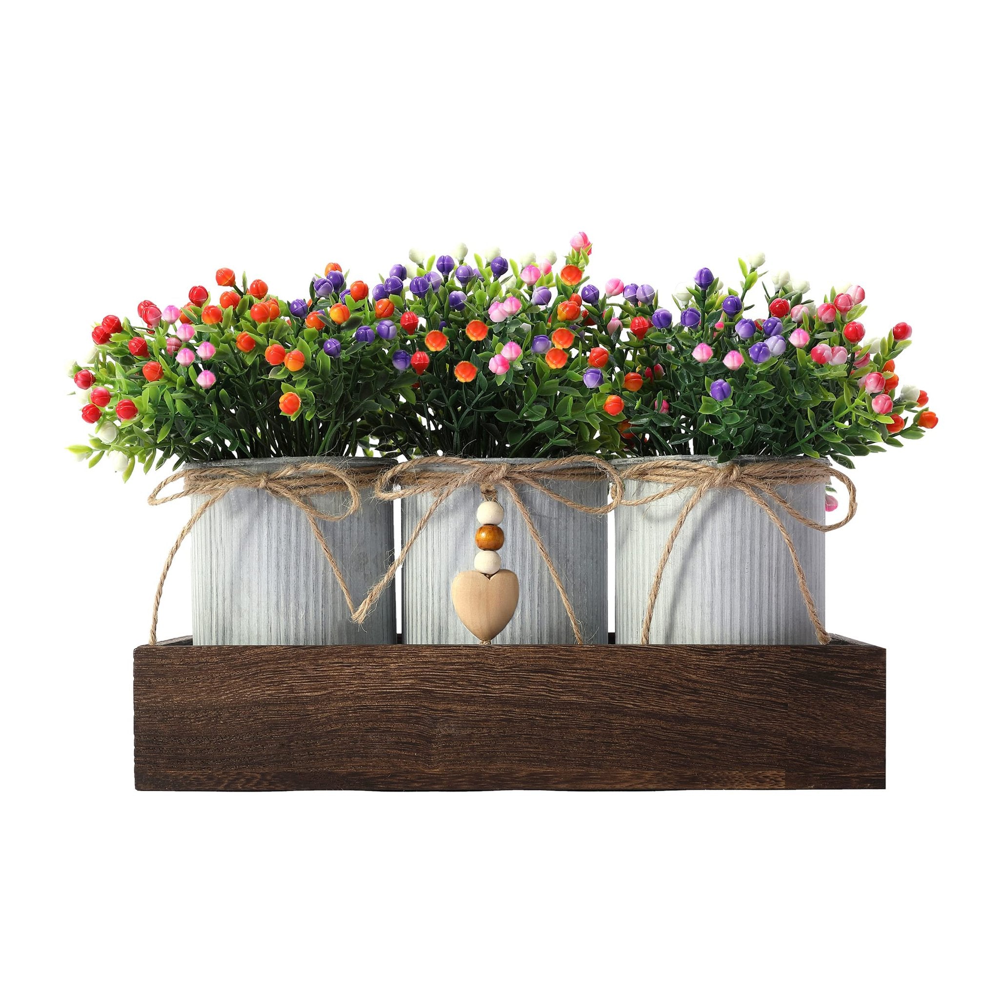 Artificial flower centerpiece with three galvanized metal pots on a wooden tray, featuring colorful berry-like blooms and a wooden heart charm.