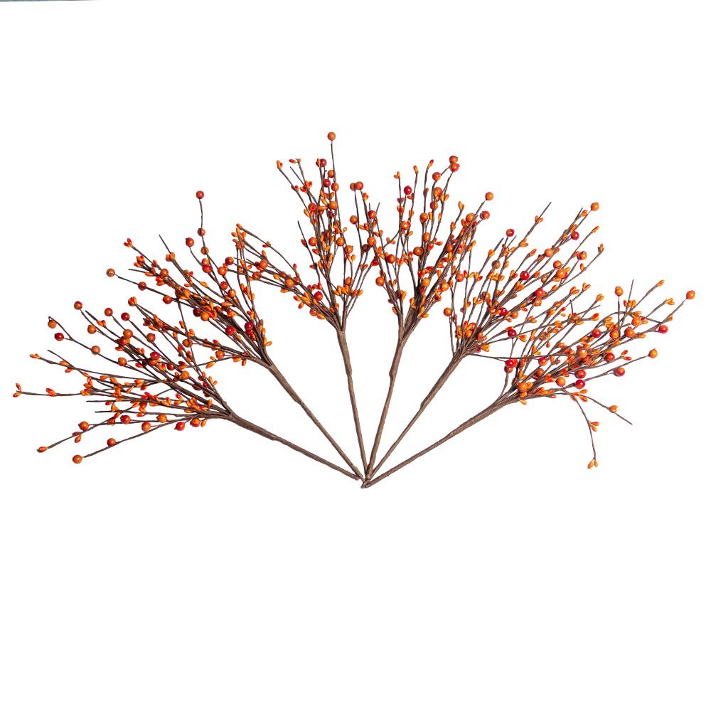 Set of artificial orange berry stems fanned out against a white background, showcasing fall decor elements.