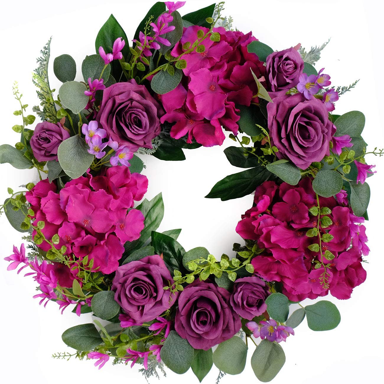Artificial purple rose and hydrangea wreath with eucalyptus leaves on a white background