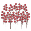 Artificial red holly berry picks with frosted foam balls on brown stems, arranged in a cluster against a white background.