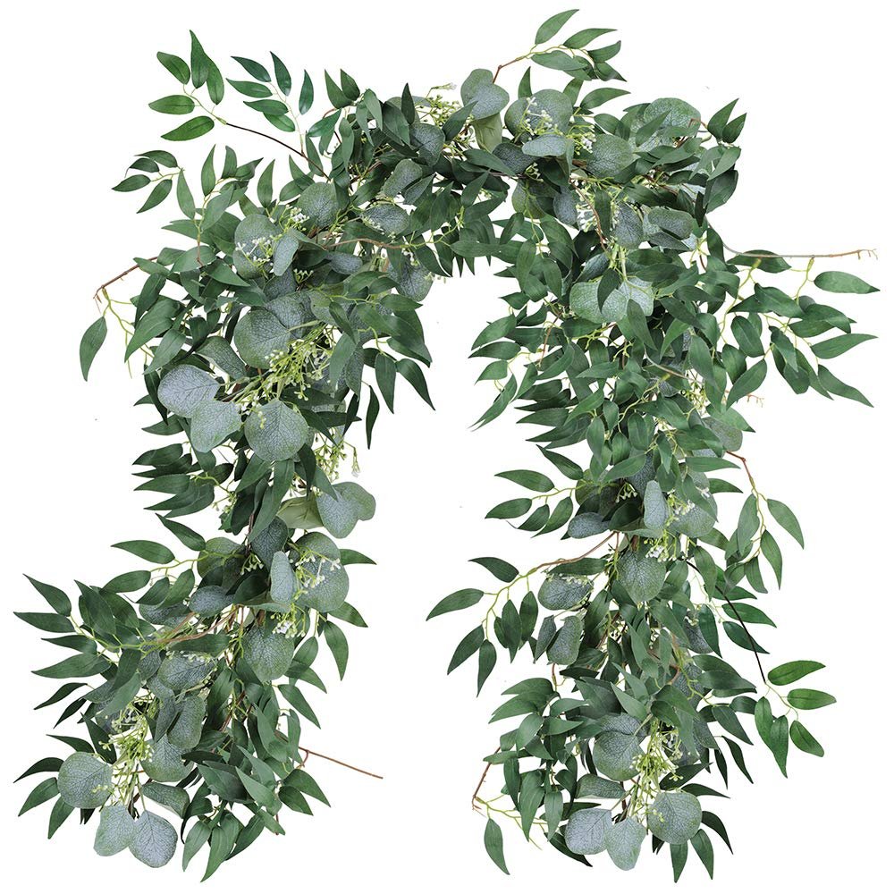 Artificial silver dollar eucalyptus and willow twig garland draped against a white background.
