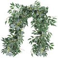 Artificial silver dollar eucalyptus and willow twig garland draped against a white background.