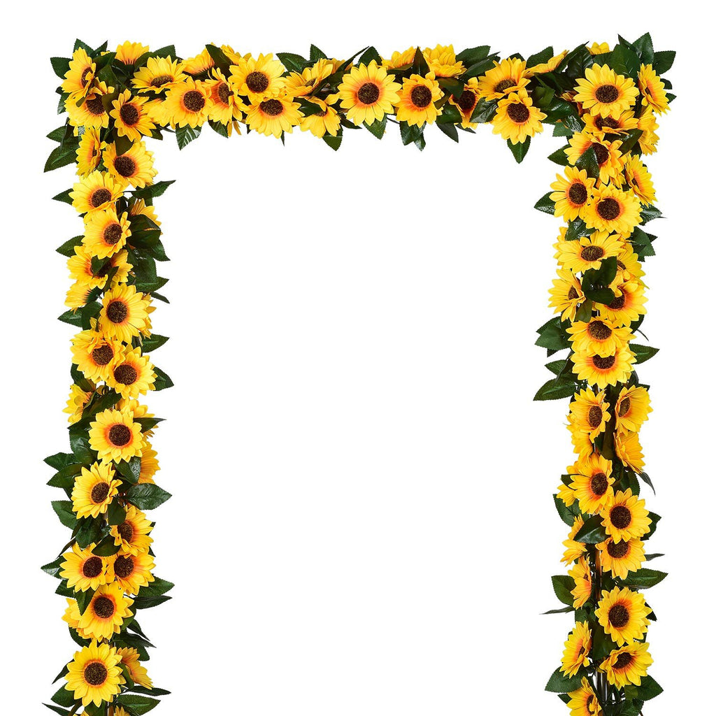 Artificial sunflower garland arranged in an arch shape against a white background.