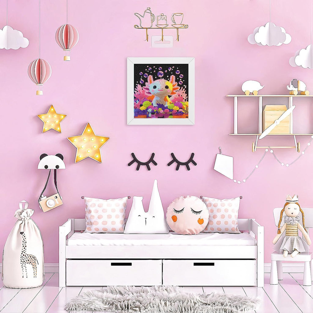 Diamond art painting of an axolotl with coral and bubbles, framed and hanging on a pink wall above a white daybed.