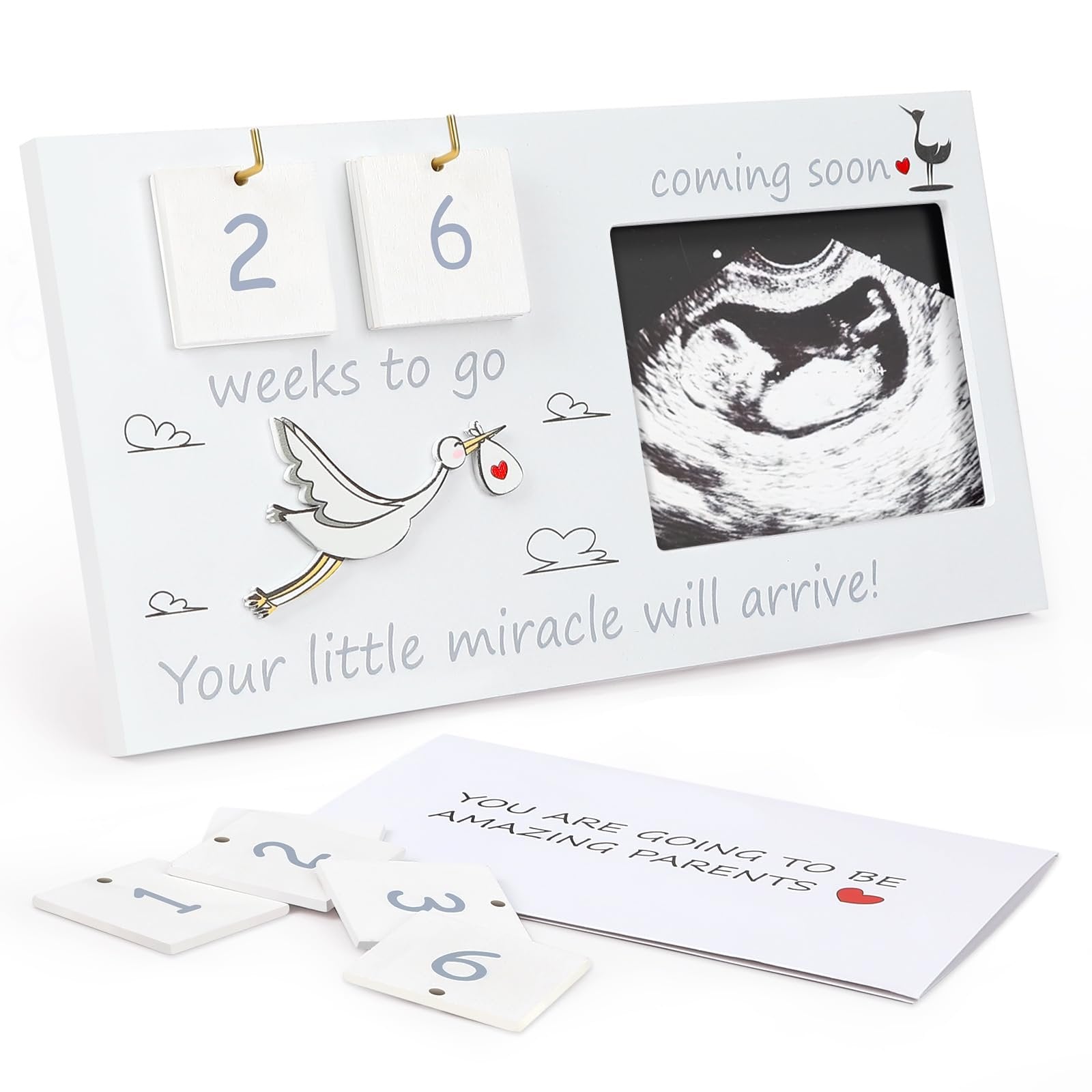 Baby sonogram picture frame with countdown blocks and stork design. Includes loose number tiles and a card.