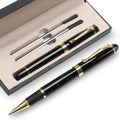 Black metal ballpoint pen gift set with gold accents and two ink refills in a black presentation box.