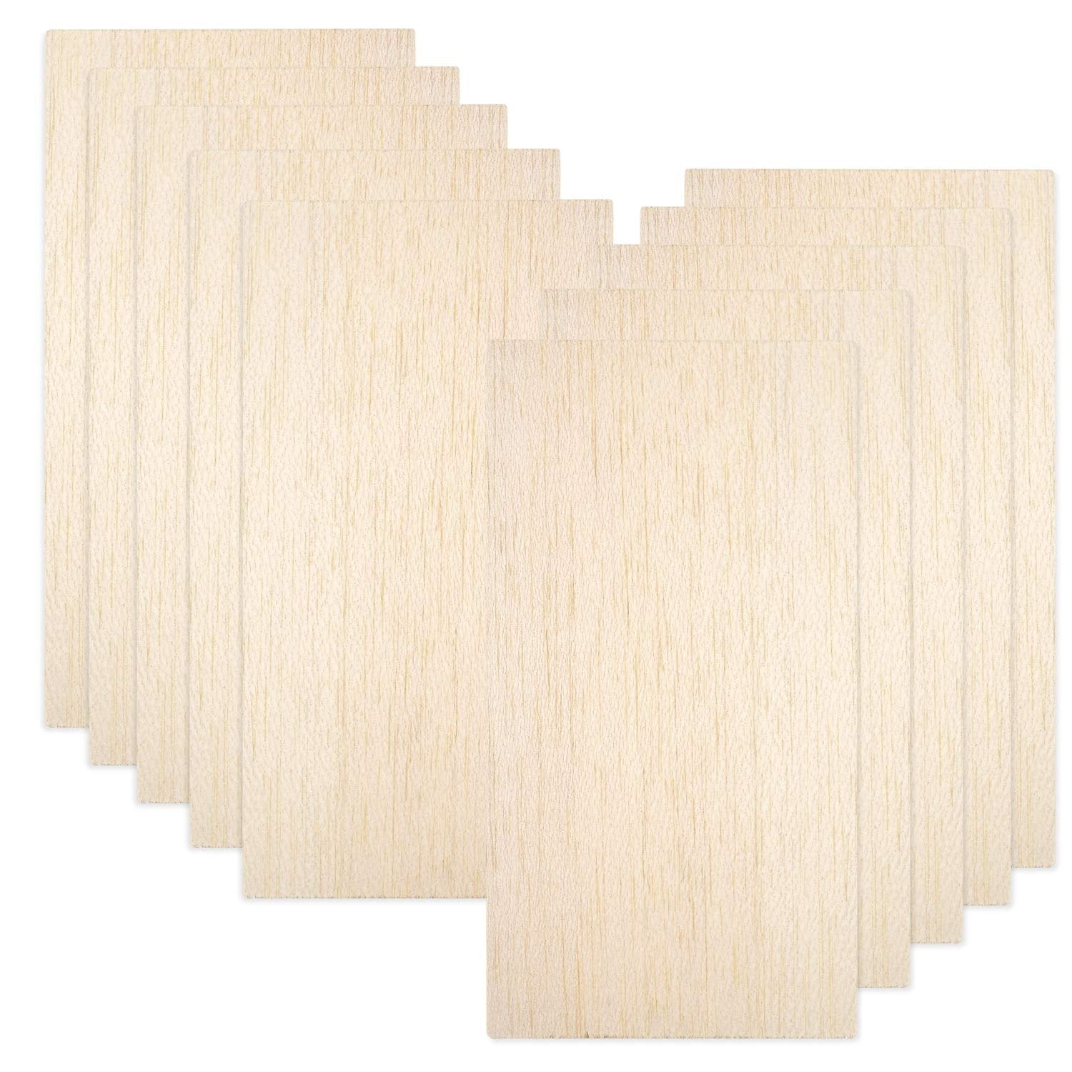 Ten thin balsa wood sheets arranged in a staggered fanned pattern on a white background.