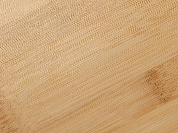 Close-up of a light brown bamboo bead board with visible grain and texture.