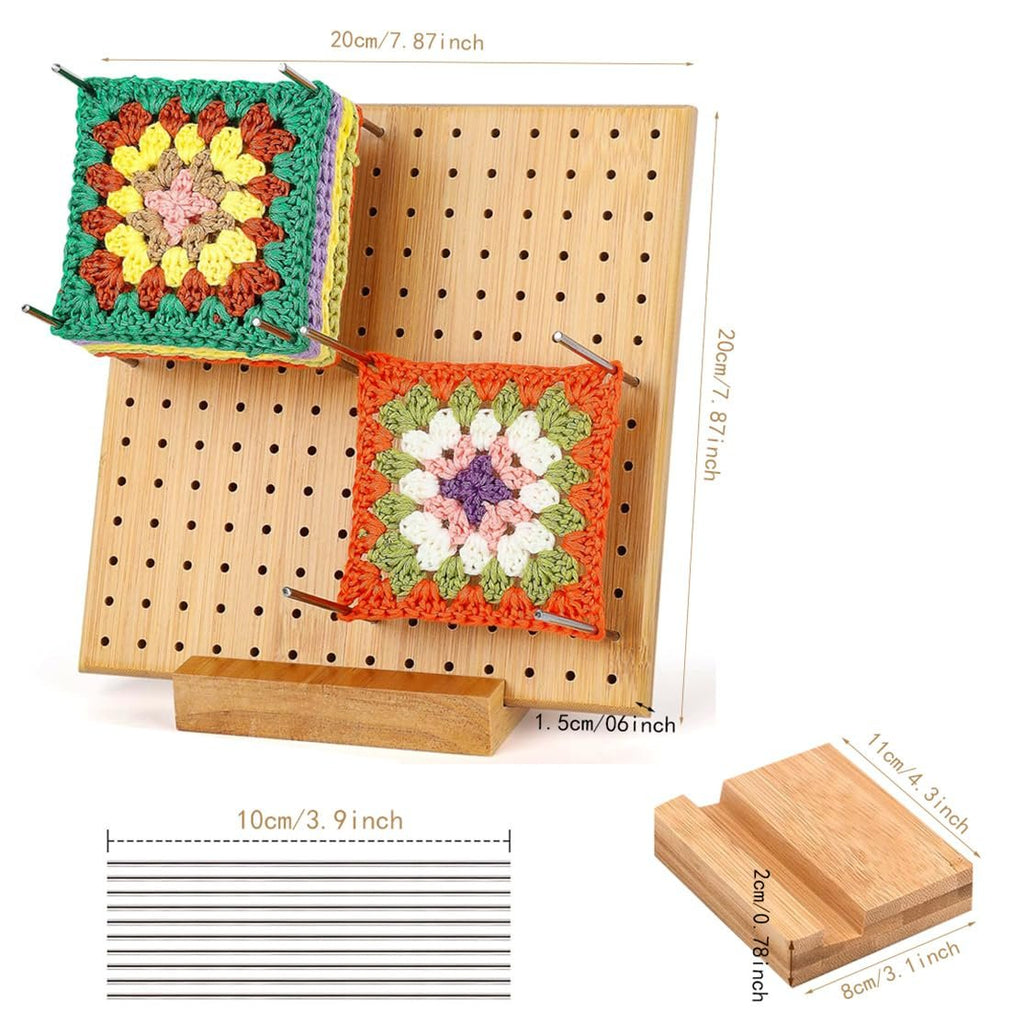 Bamboo crochet blocking board with two crocheted squares attached by stainless steel pegs, showing dimensions.
