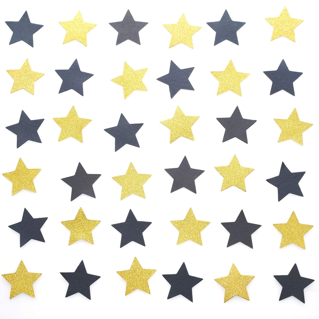 Black and gold glitter star confetti scattered on a white background, top-down view.