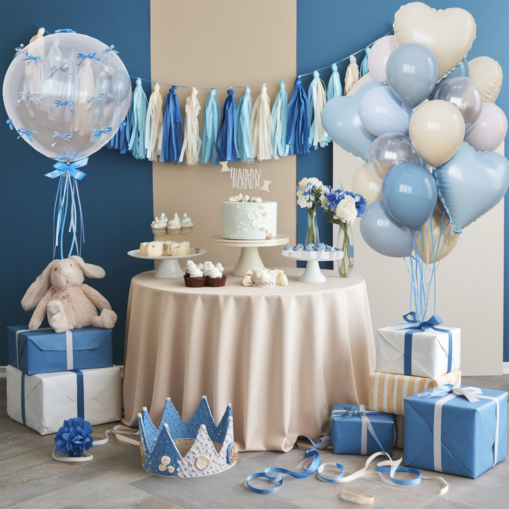 Birthday party setup with balloons, cake, cupcakes, gifts, and a crown.