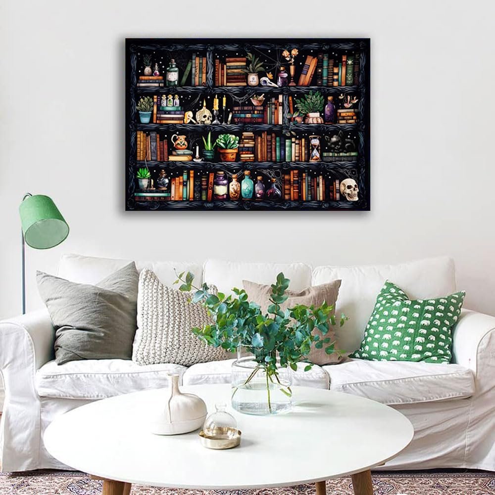Stamped cross stitch kit depicting a bookshelf filled with books, potions, plants, and skulls, displayed on a wall above a sofa.