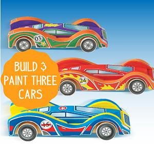 Three colorful wooden race cars, two with flames and one with floral designs, displayed against a blue gradient background.