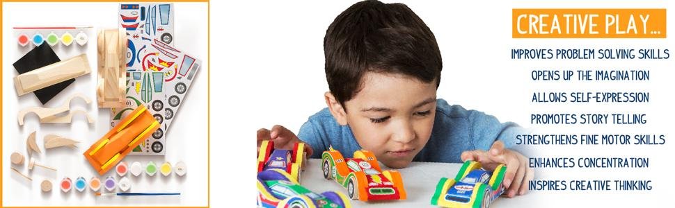 Wooden race car craft kit contents and a child playing with painted cars. Includes pre-cut wood pieces, paints, stickers, and brush.