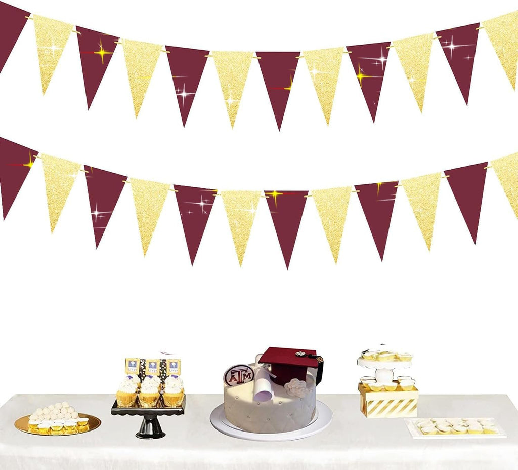 Burgundy and gold glitter triangle bunting garlands above a dessert table with a graduation cake and cupcakes.