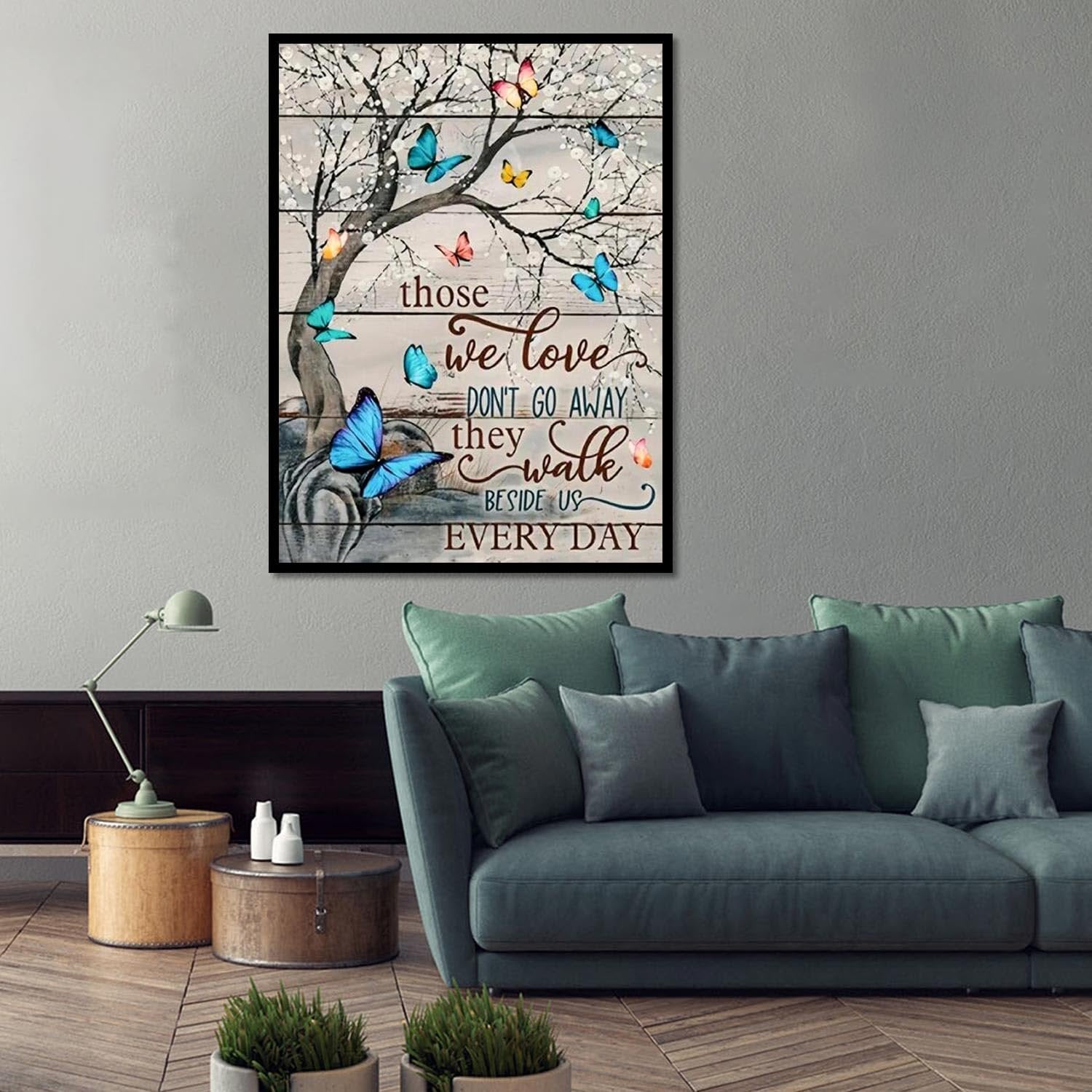 Butterfly diamond painting art with inspirational quote displayed in a living room setting.