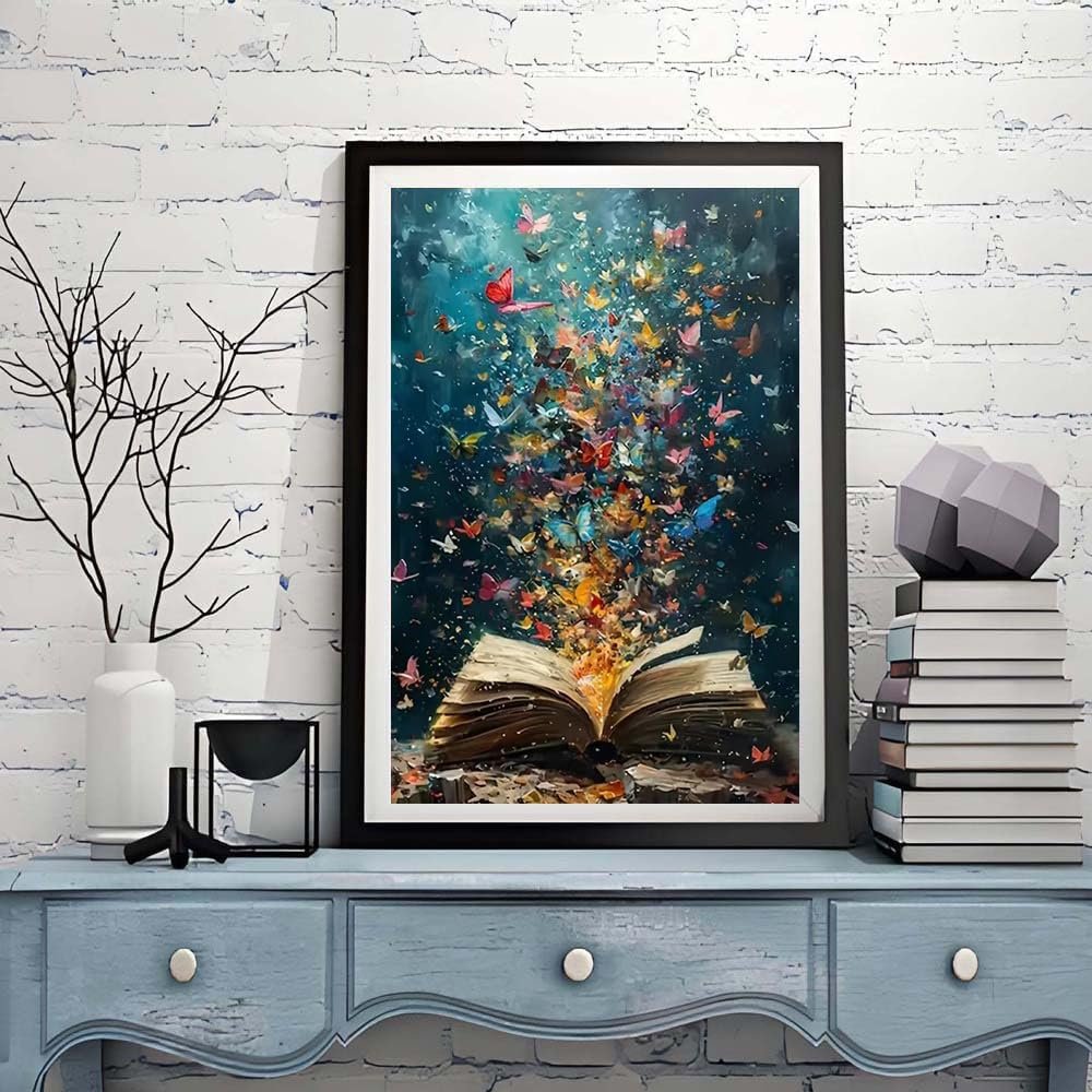 Diamond painting kit artwork of an open book with colorful butterflies emerging from its pages, framed and displayed on a shelf.