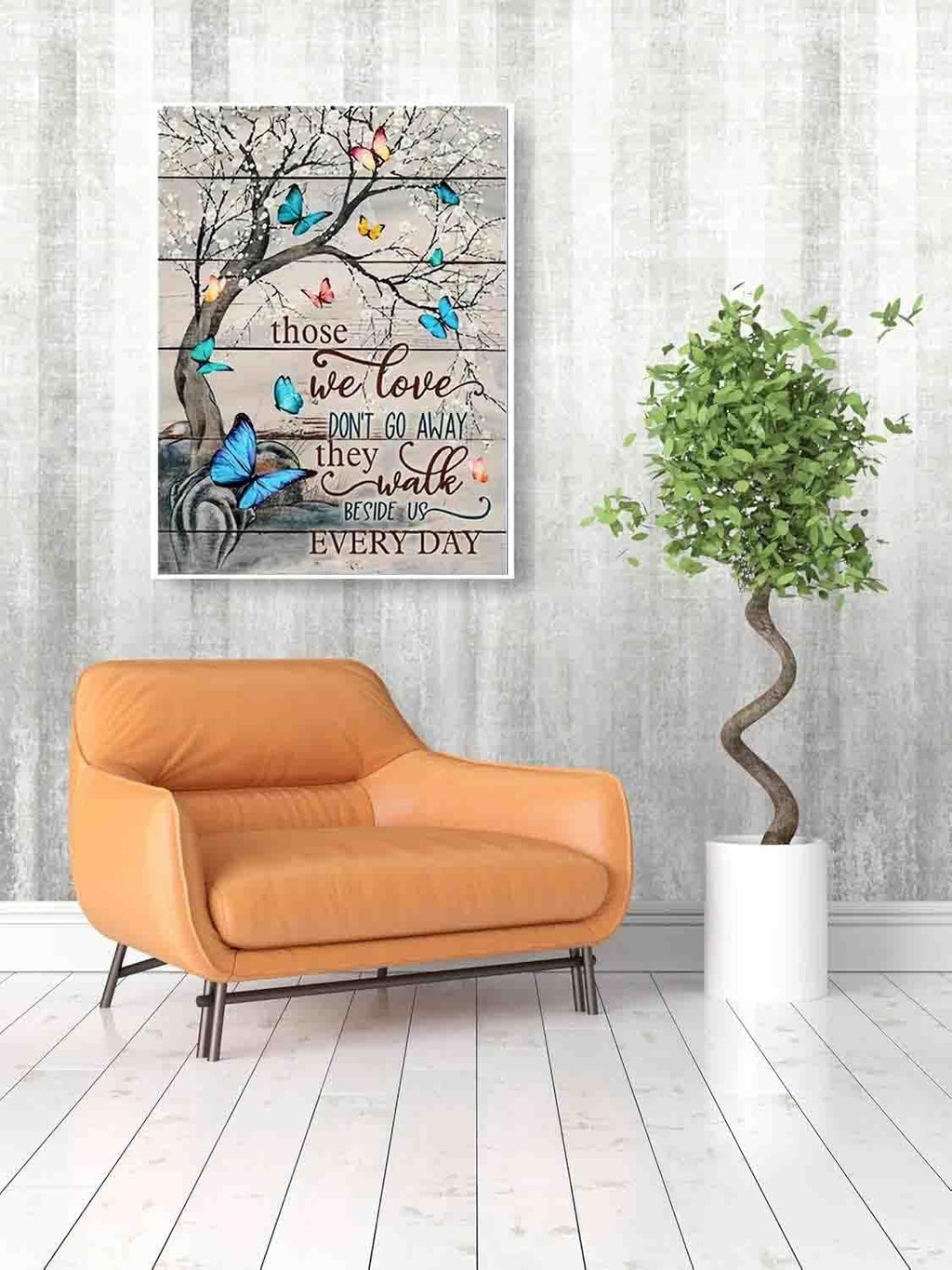 Butterfly tree artwork with quote 'Those we love don't go away, they walk beside us every day' displayed in a room with a chair and plant.