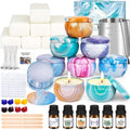 Candle making kit contents including soy wax blocks, decorative tins, wicks, essential oils, and dyes.