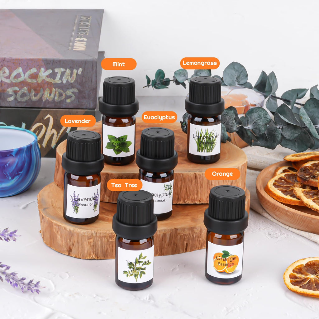 Collection of essential oil bottles with labels for Mint, Lemongrass, Lavender, Eucalyptus, Tea Tree, and Orange, arranged on wooden stands with decorative elements.