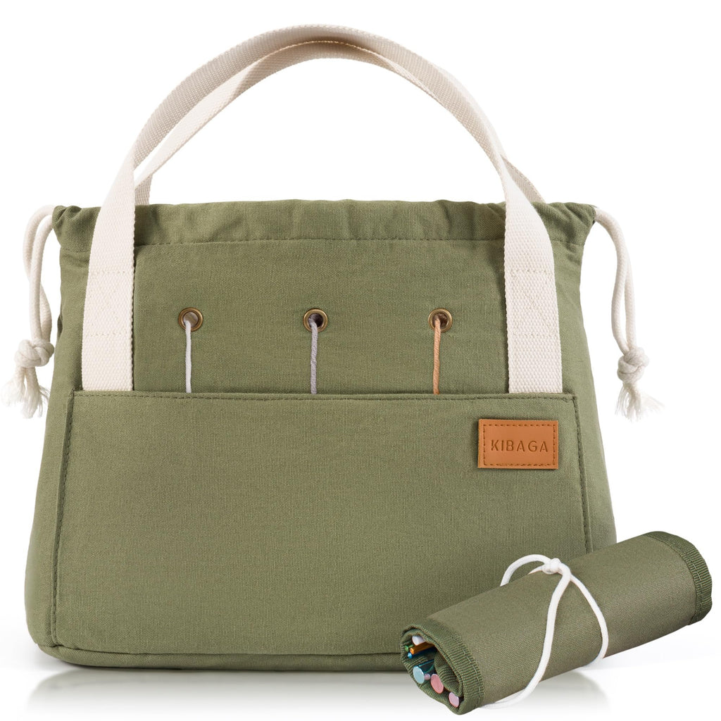Green canvas crochet bag organizer with white handles and a rolled-up pouch of yarn and needles in front.