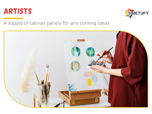 Artist painting watercolor circles on a canvas panel with a palette and brushes nearby