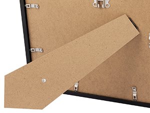Close-up of the back of a black certificate frame showing the easel stand and metal clips for securing the backing.