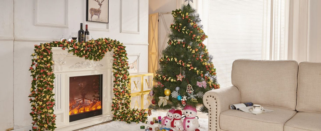 Champagne artificial rose vine garland draped over a fireplace and around a Christmas tree, with decorative elements like wine bottles, snowmen, and ornaments.