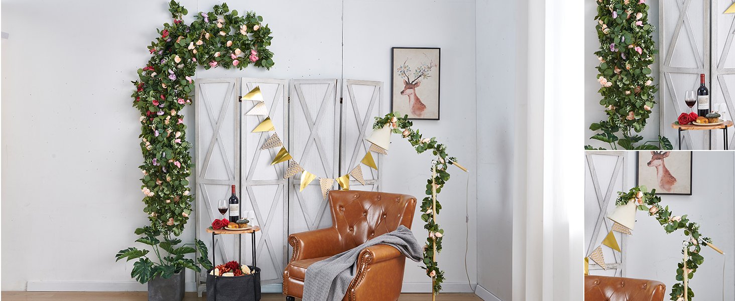 Champagne artificial rose vine garland draped on a wall and around a floor lamp, with a leather chair and decorative screen.