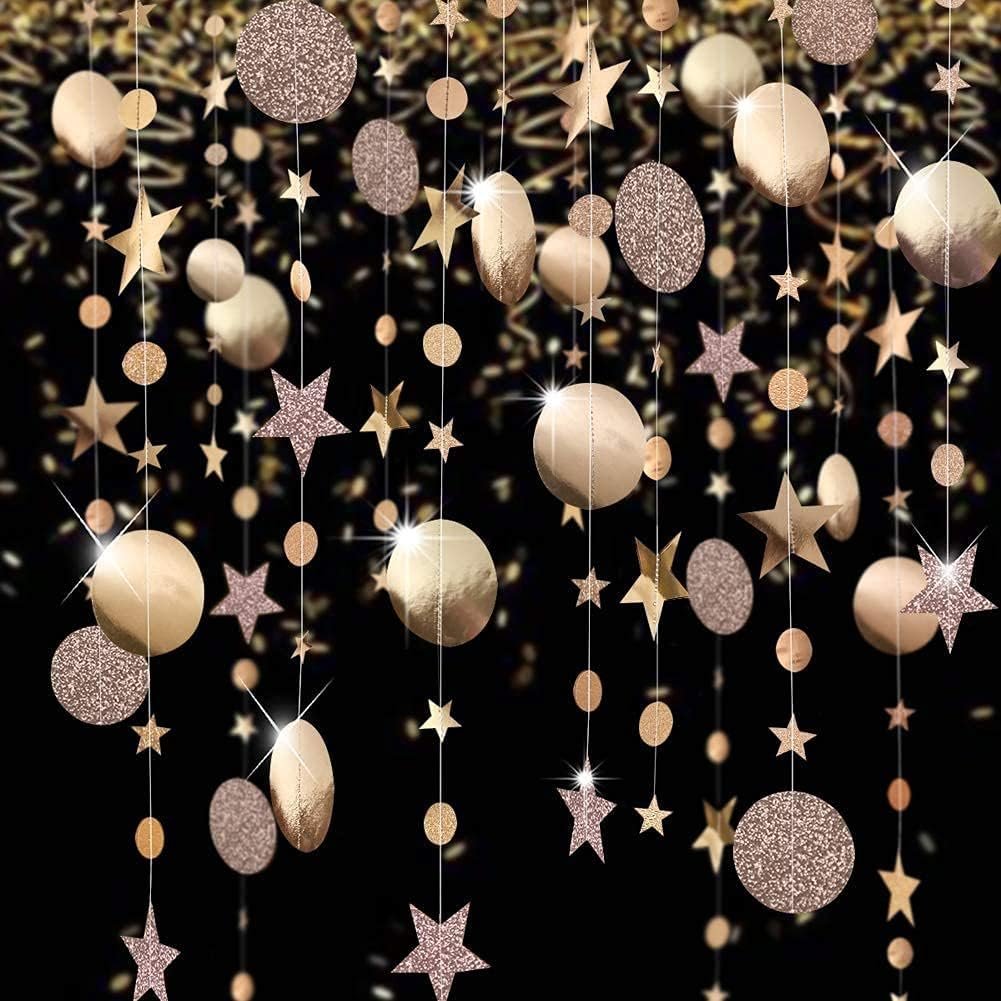 Champagne gold star and circle garland hanging against a black background, featuring glitter and metallic finishes.